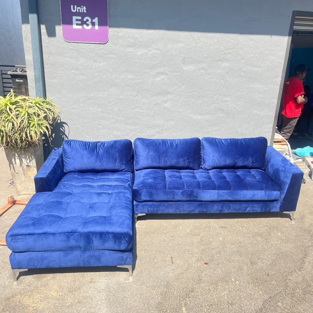 Blue velvet L-shape sectional couch after reupholstery by Wan-Puck Upholstery